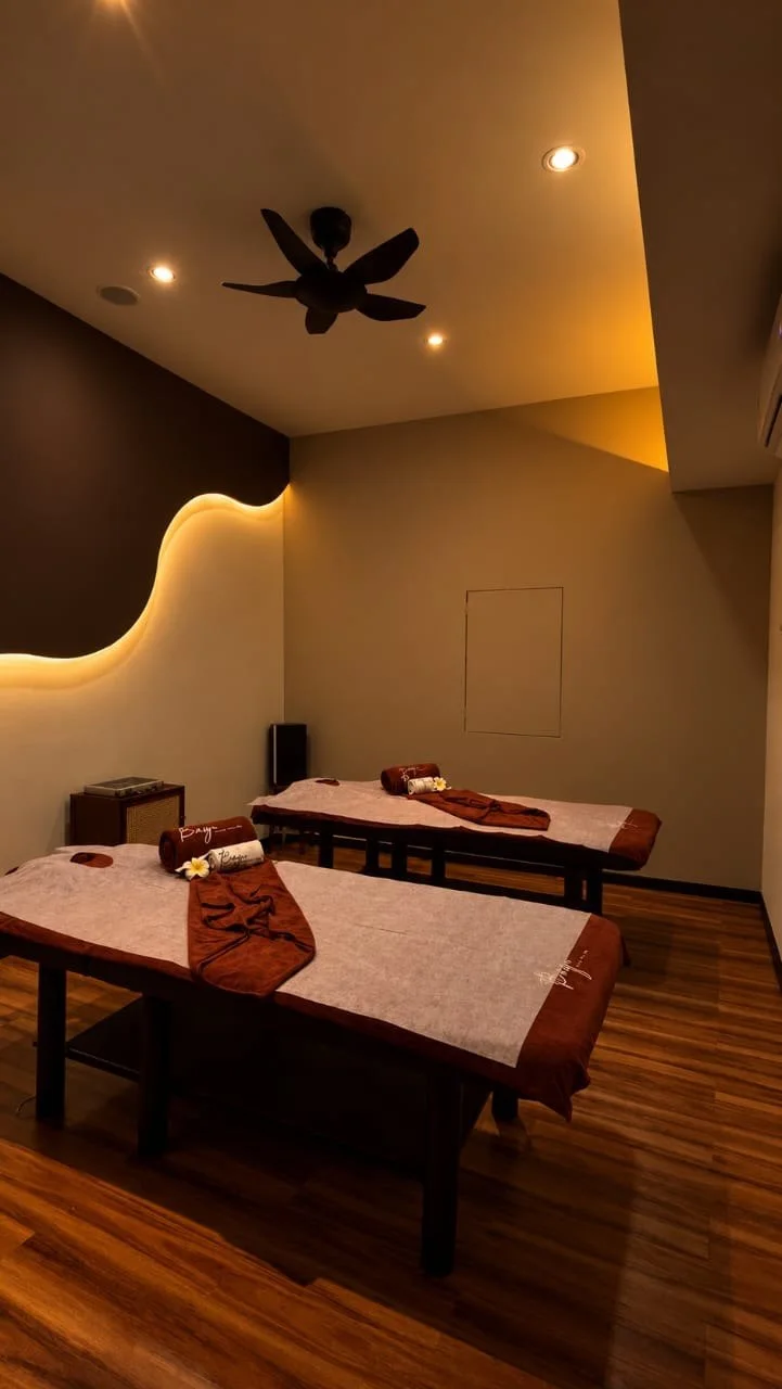Warm lighting and prepared massage beds at Bayu